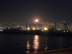 Beirut at night with a large moon